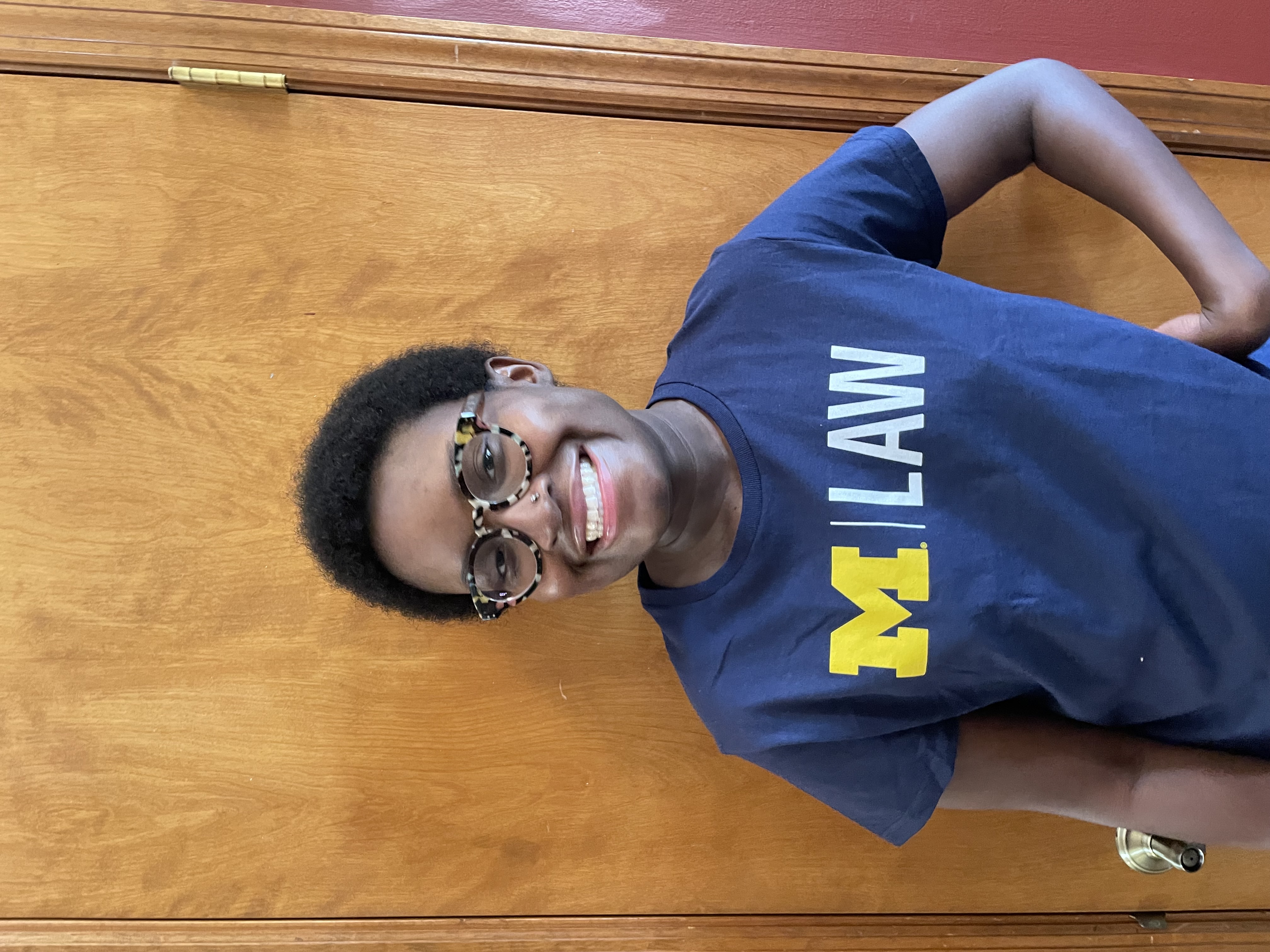 Awo in a University of Michigan Law school t-shirt.