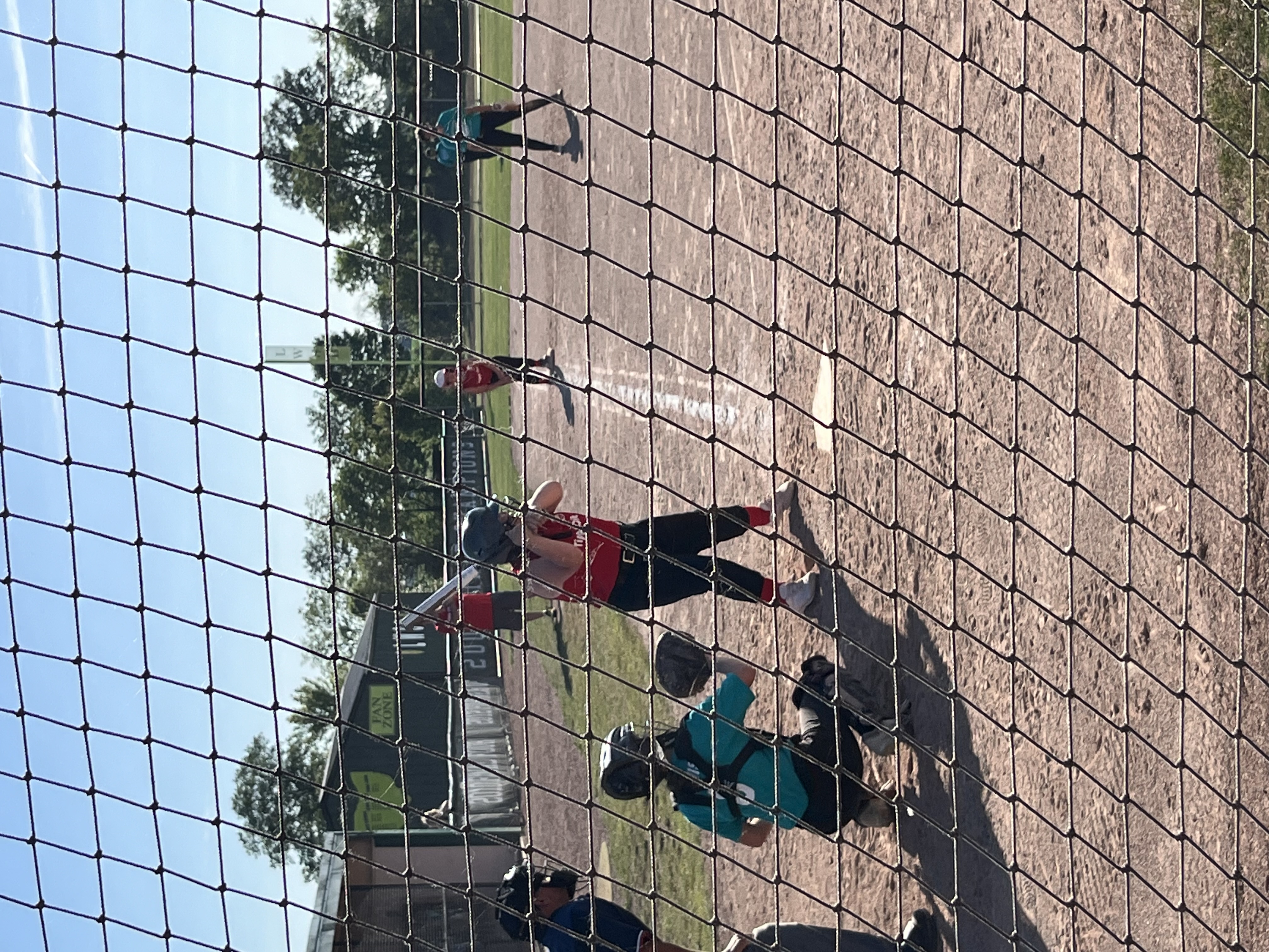 Lexie playing softball