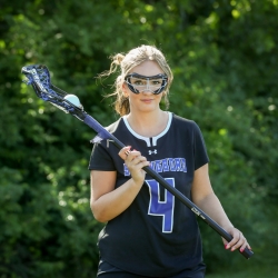 tatum holding lacrosse stick and ball