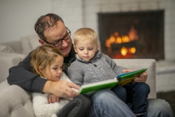 family reading a book together