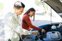 teenager helping with car maintenance