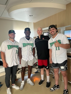 Brandon with three Dayton Dragons baseball players in hospital room