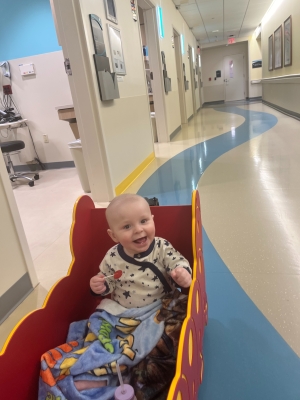 Nolan in wagon in hospital hallway