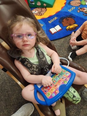 Violet playing with educational toy