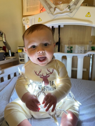 Nolan O with holiday lights in hospital