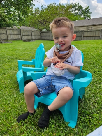 Ciro sitting in chair by himself