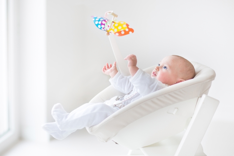 baby in a swing chair