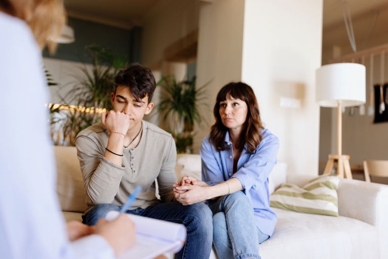 mother and son discussing therapy together