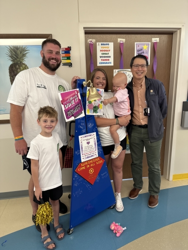 Blakely and her family with Dr. Chow after bell-ringing ceremony