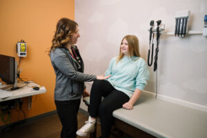 young girl gets a sports physical at Kids Express