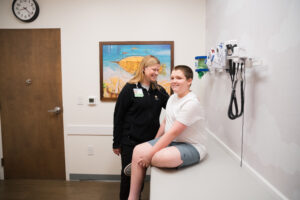 boy receives sports physical at Kids Express