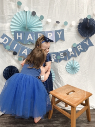 Reece and Laynie giving big hugs at their diabetes anniversary ("Diaversery") party