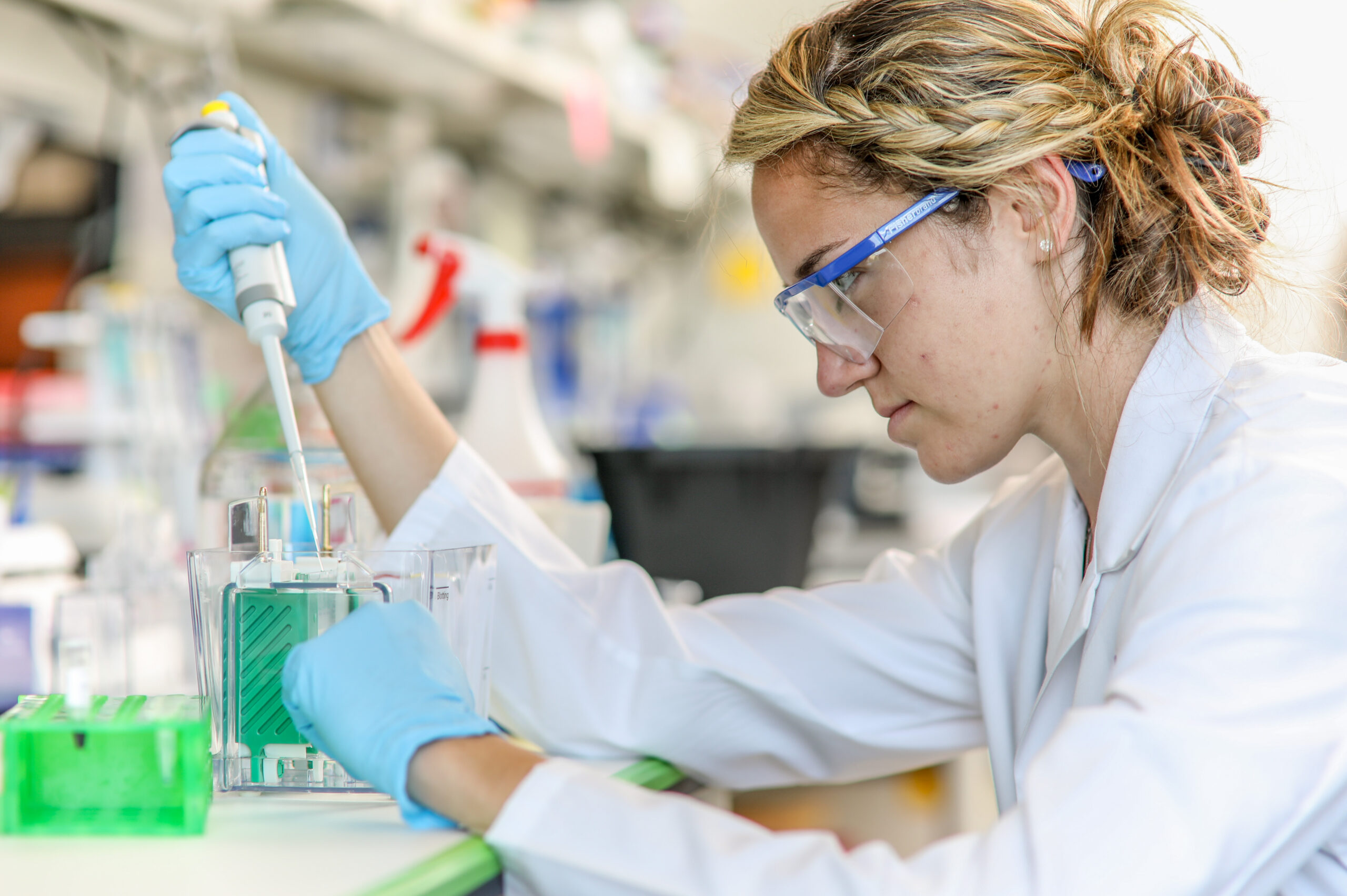 Research scientist working with test samples.
