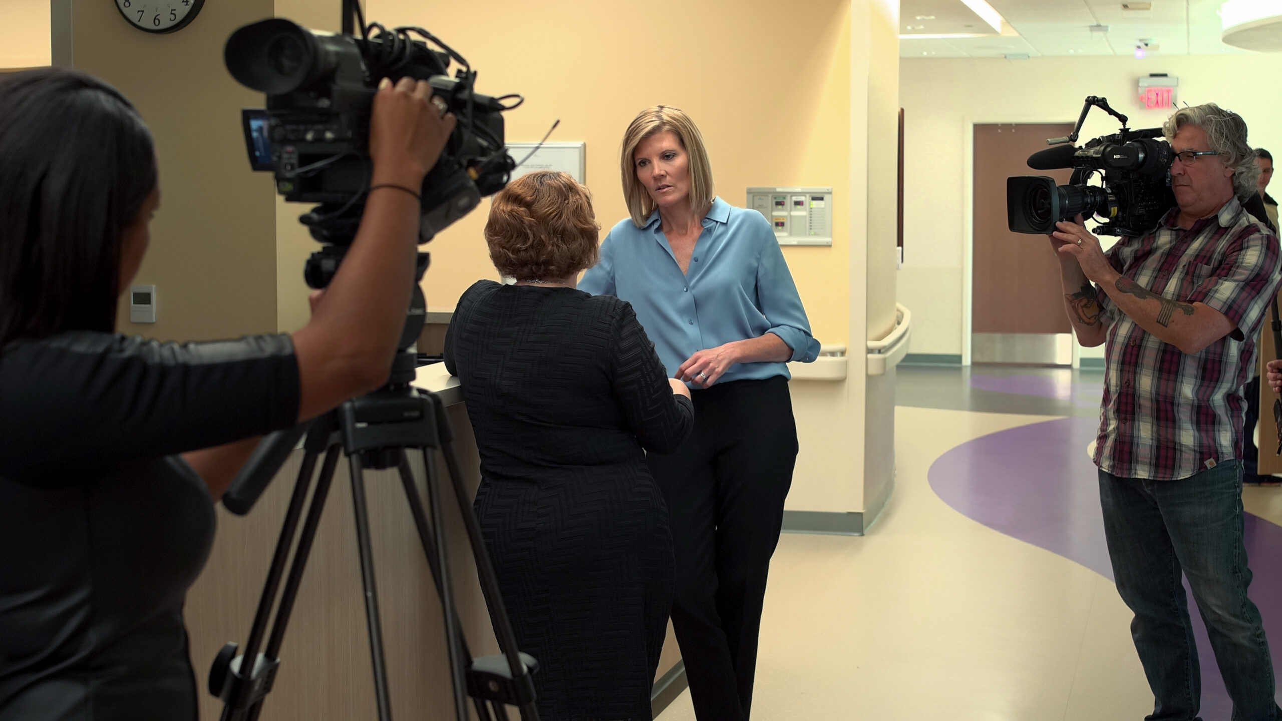 News reporter conducting interview in Children's Hospital