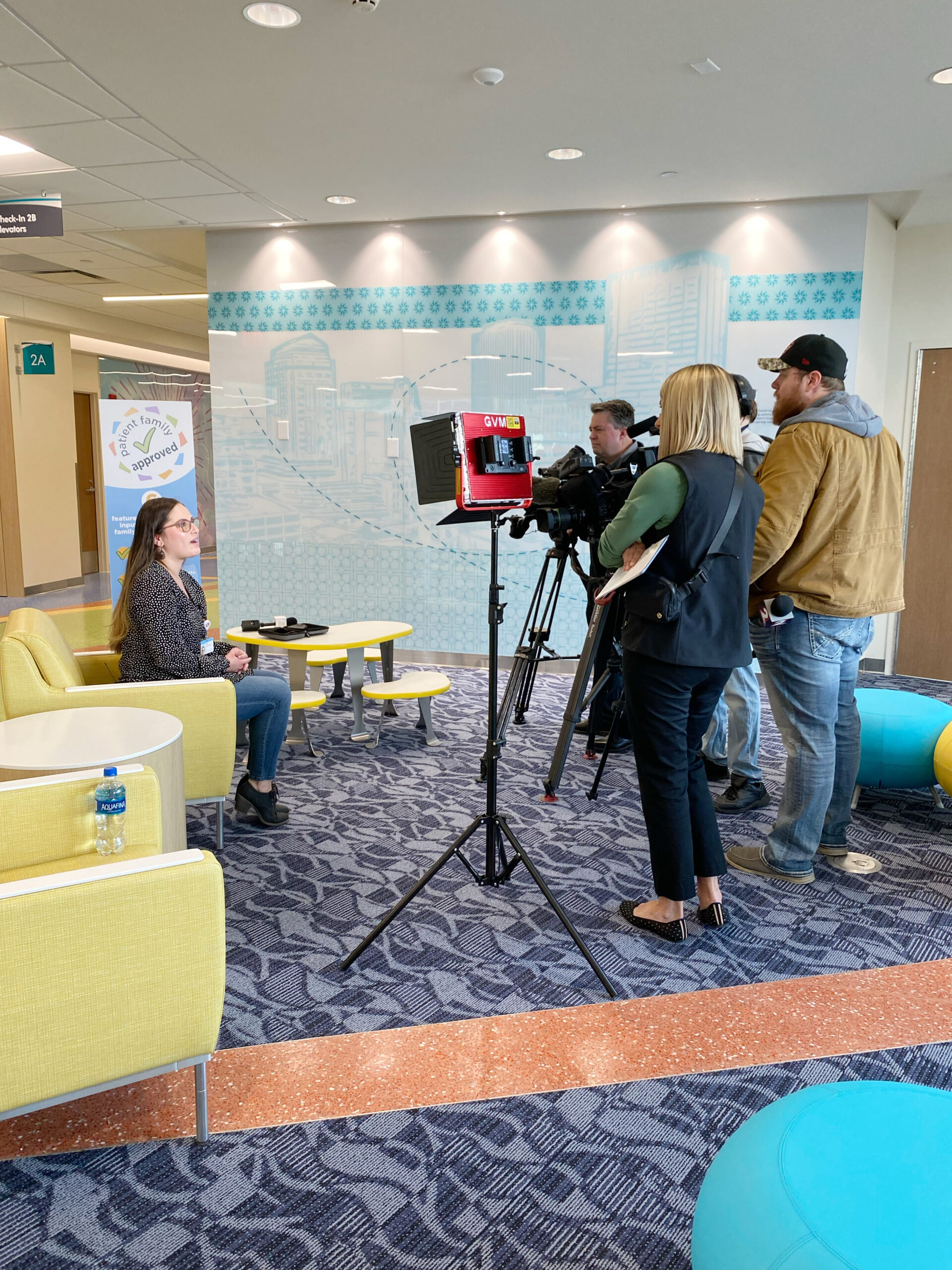 Film crew shooting a news segment inside a Children's hospital