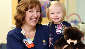 Woman and girl smiling.