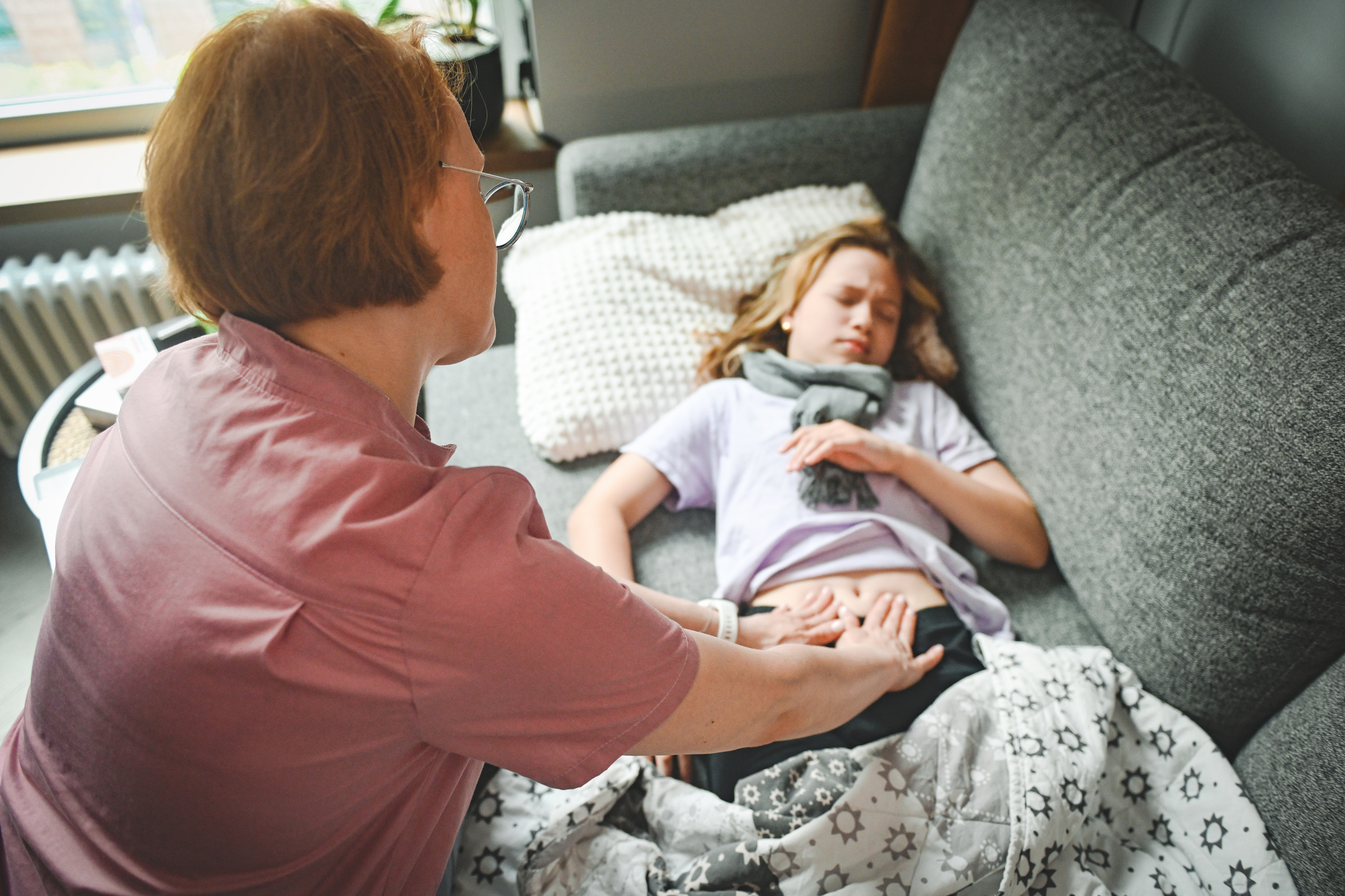doctor examines a sick child