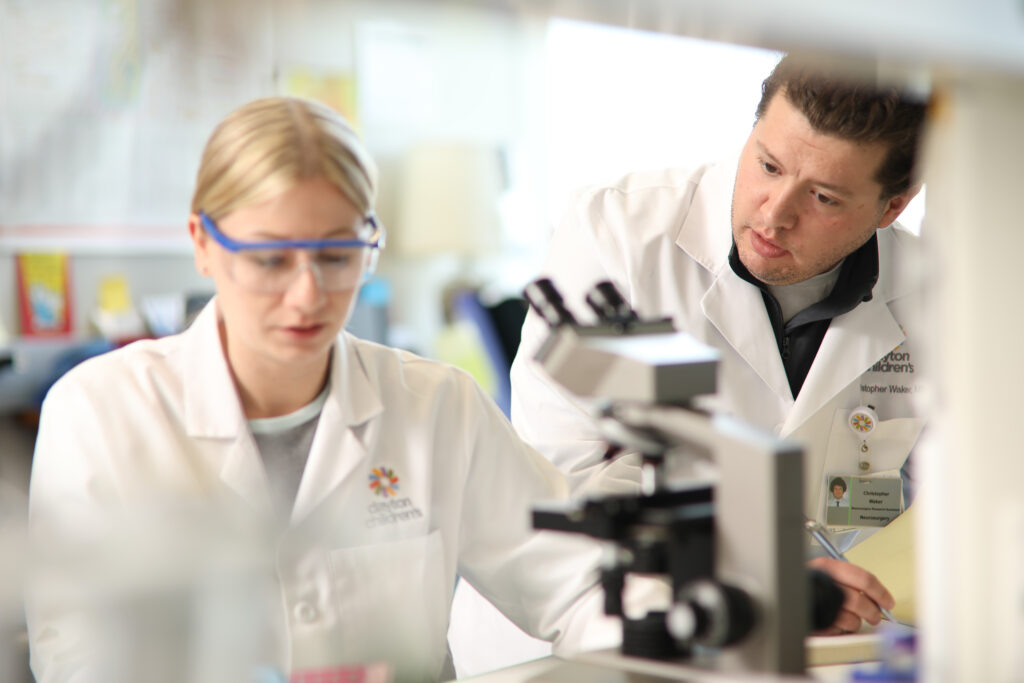 Two researchers work tirelessly to provide the best data and results for the staff.