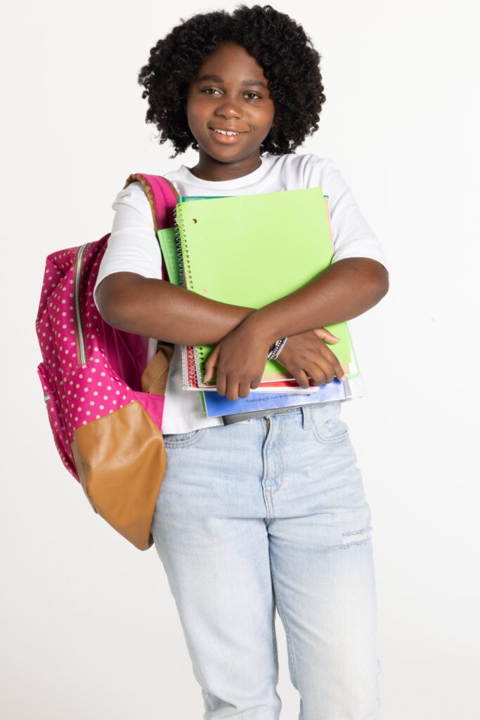 girl gets ready for school with all her supplies
