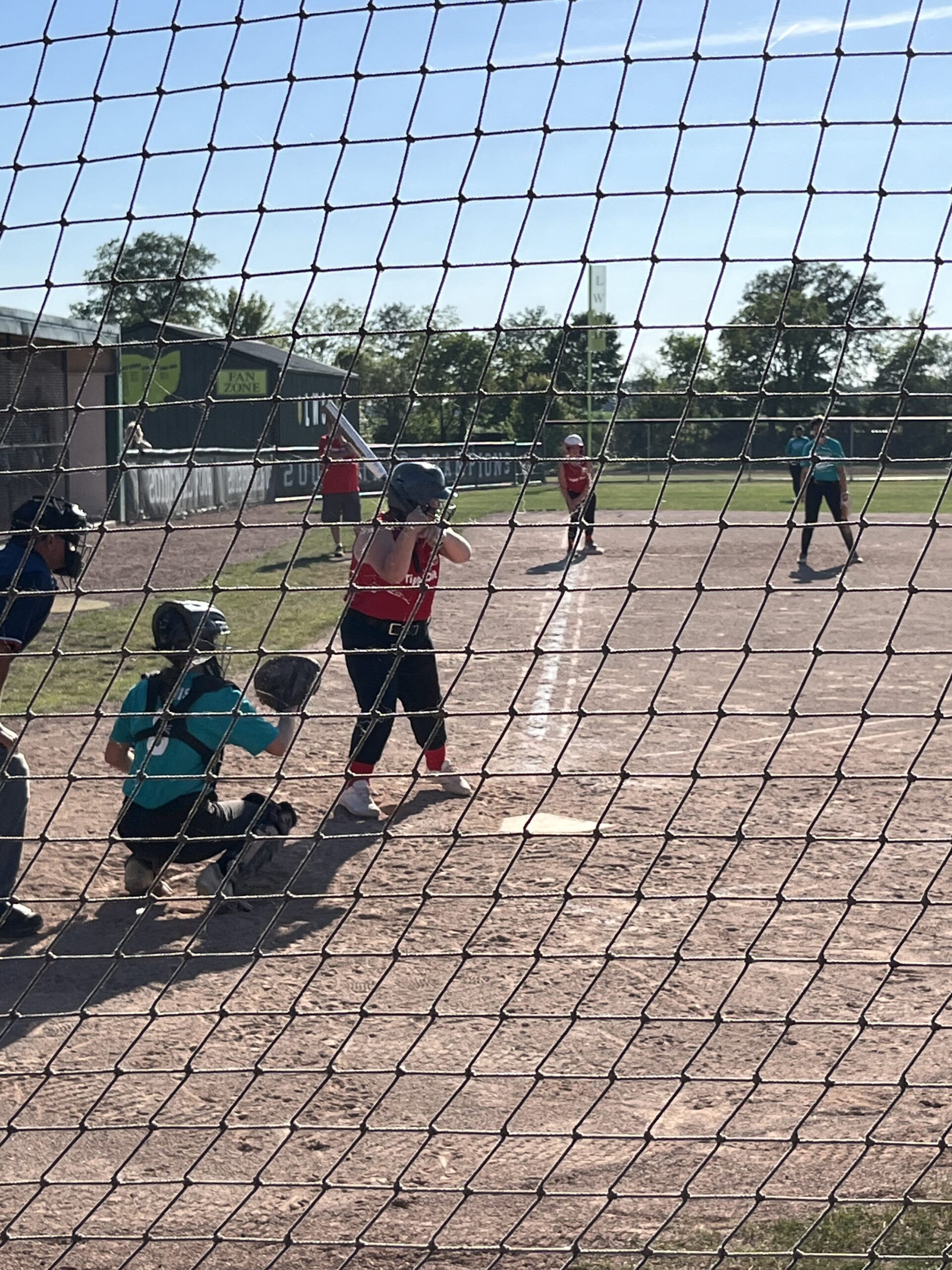 Lexie playing softball