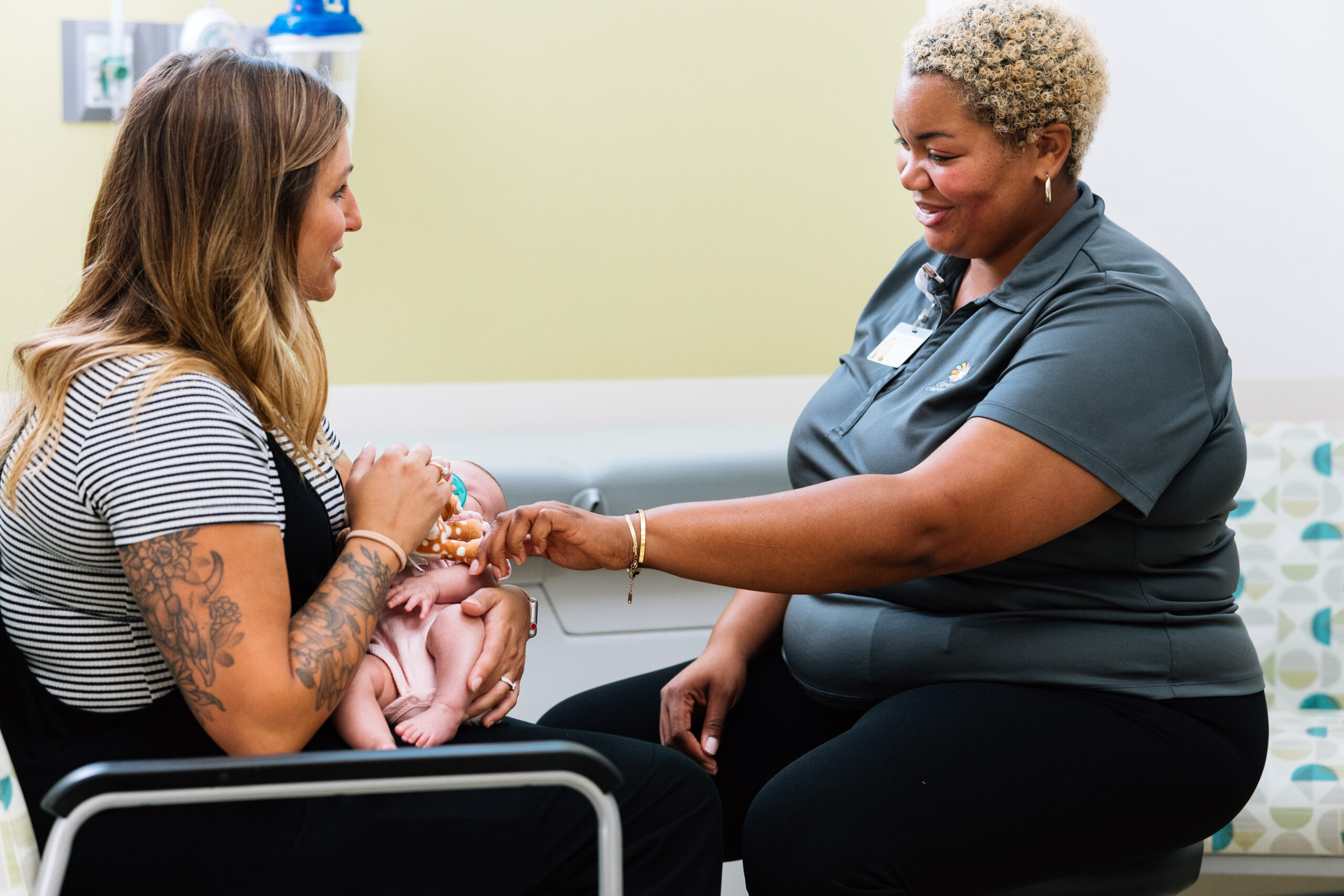 A mom and her baby meet with a community support staff member to discuss how Dayton Children’s can help at home.

