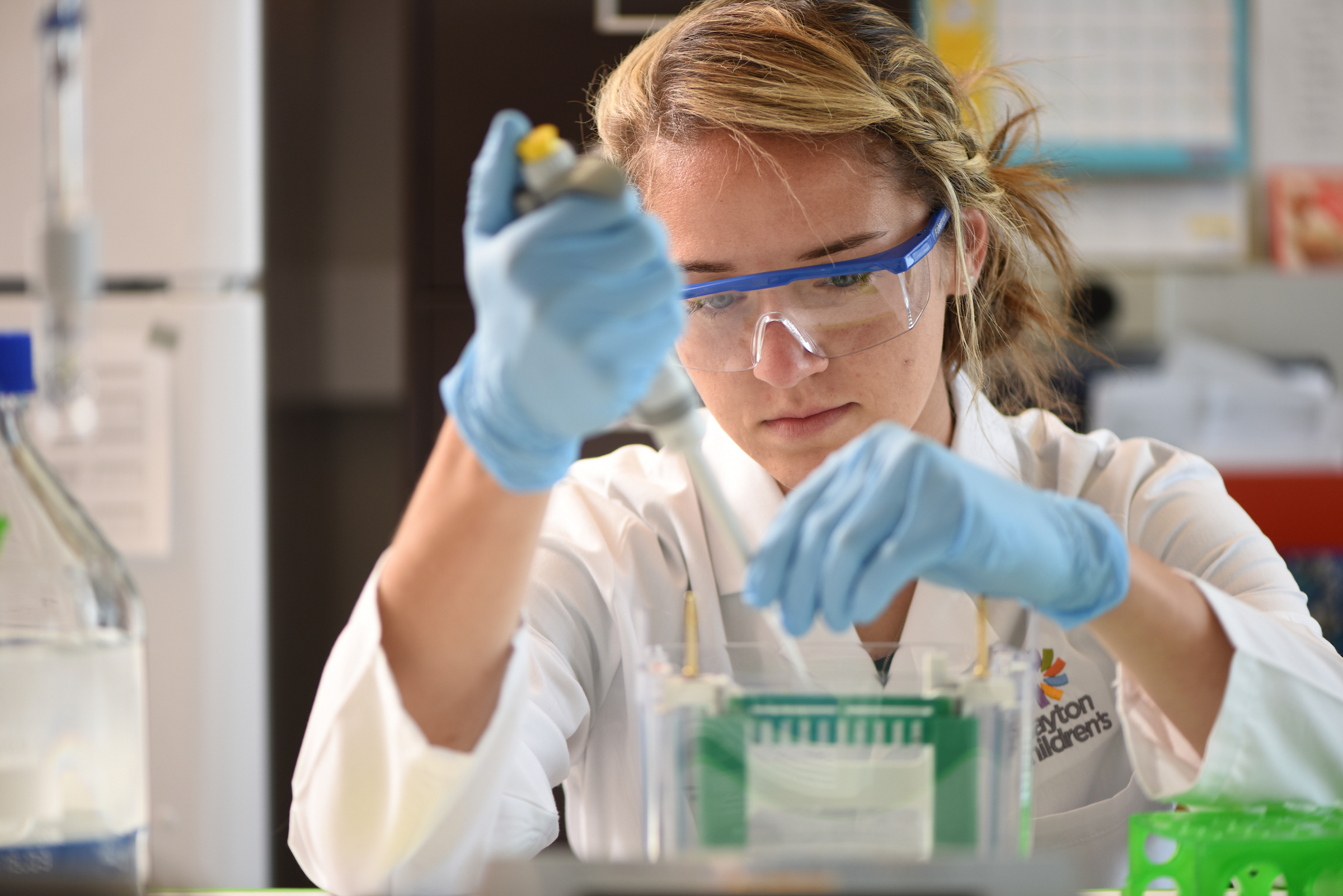 Researcher making advancements in pediatric care through study.