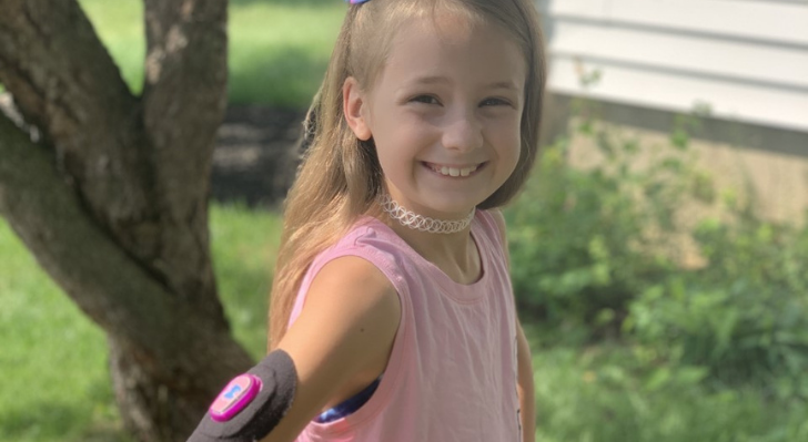 Audrey with a Dexcom monitor after being diagnosed with type 1 diabetes