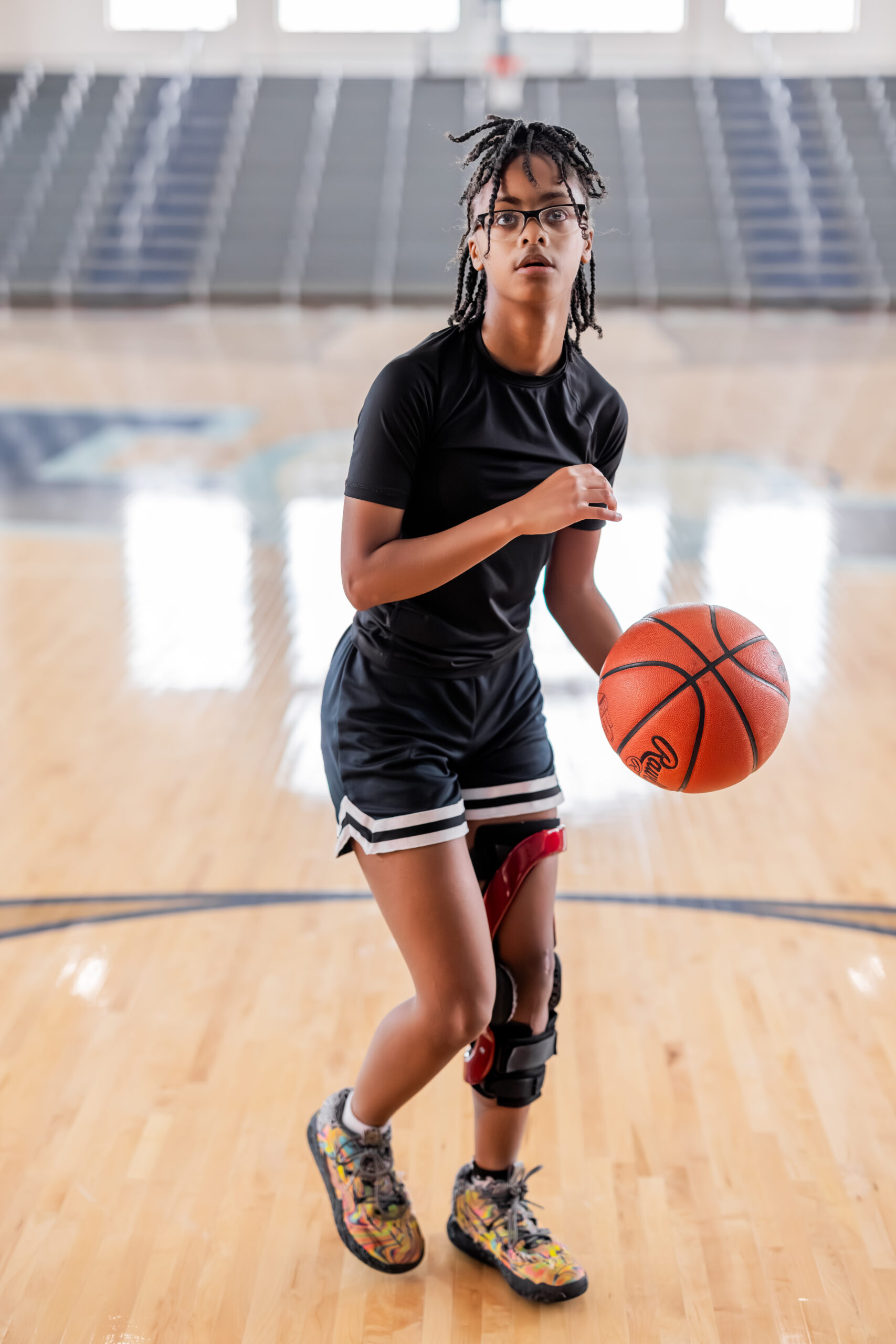 female basketball player lines up a shot in the gym