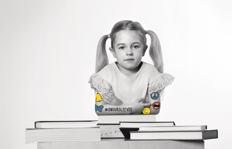 girl sits with helpful books for mental health