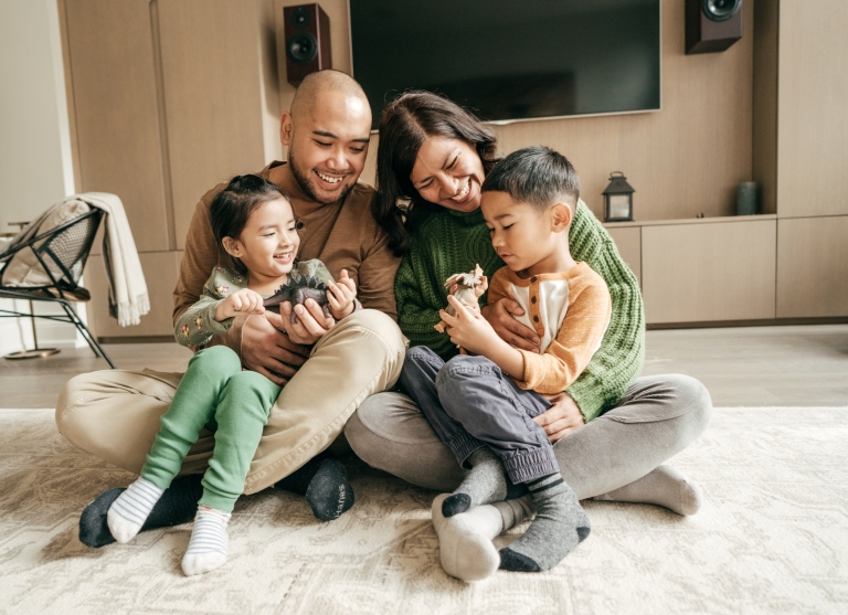 happy family plays together in living room