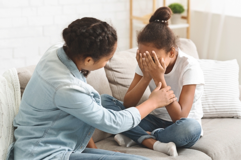 mother and daughter grieve together following a loss