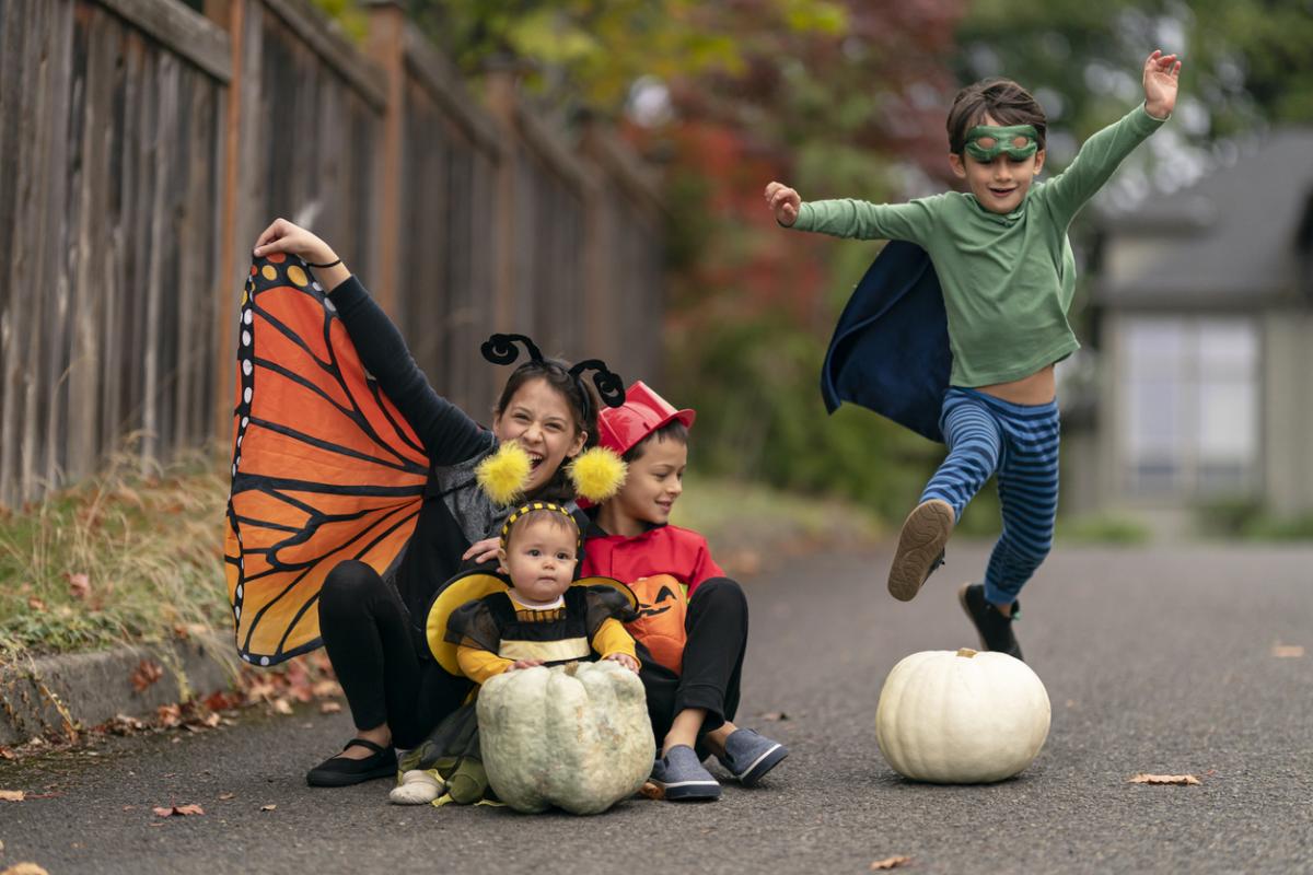 children celebrating halloween with costumes