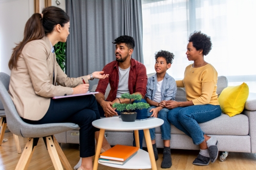 family consults with a therapist for their child