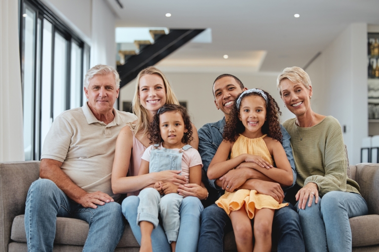 happy family poses for photo in their living room