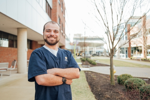 Peter Inzitari, a nurse at Dayton Children's, poses in his scrubs