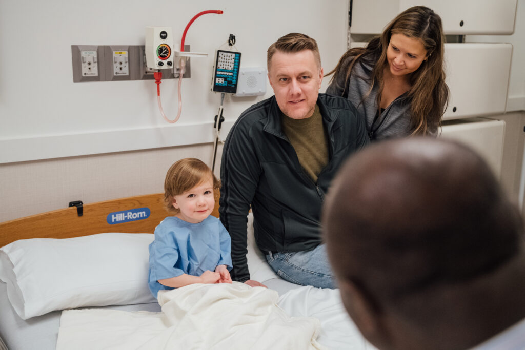 Child and family in sleep lab preparing for sleep study.