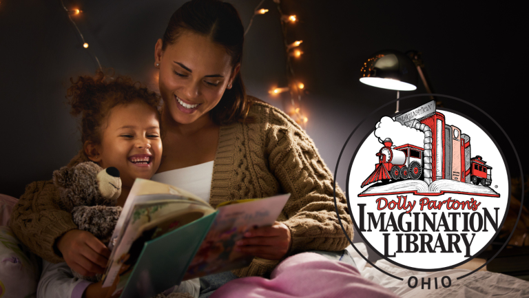 Mother and daughter read a book before bed