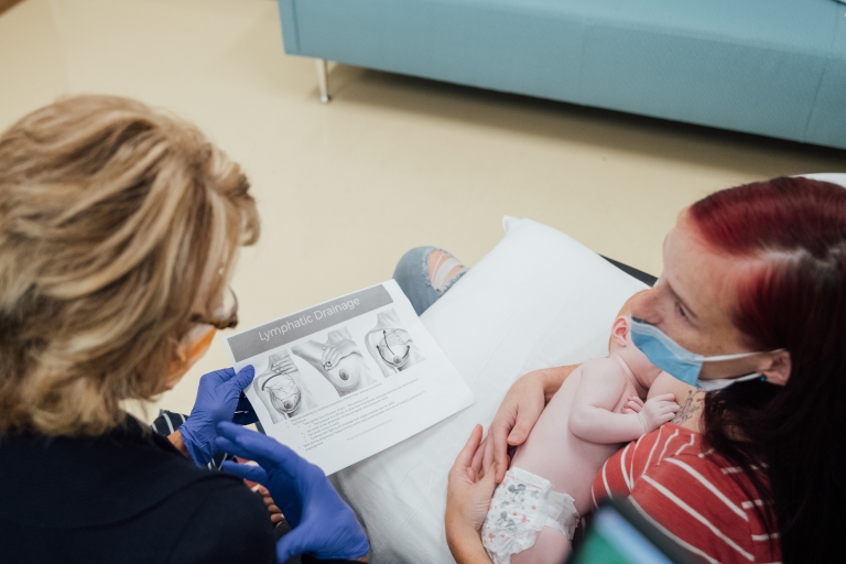 a lactation consultant meets with a new mother