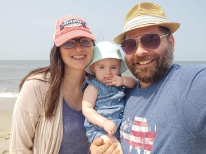 Kyle Frysinger poses with his family for a photo