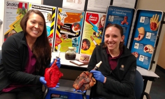 Lacie Shepherd, a respiratory therapist at Dayton Children's, poses for a photo with a fellow team member