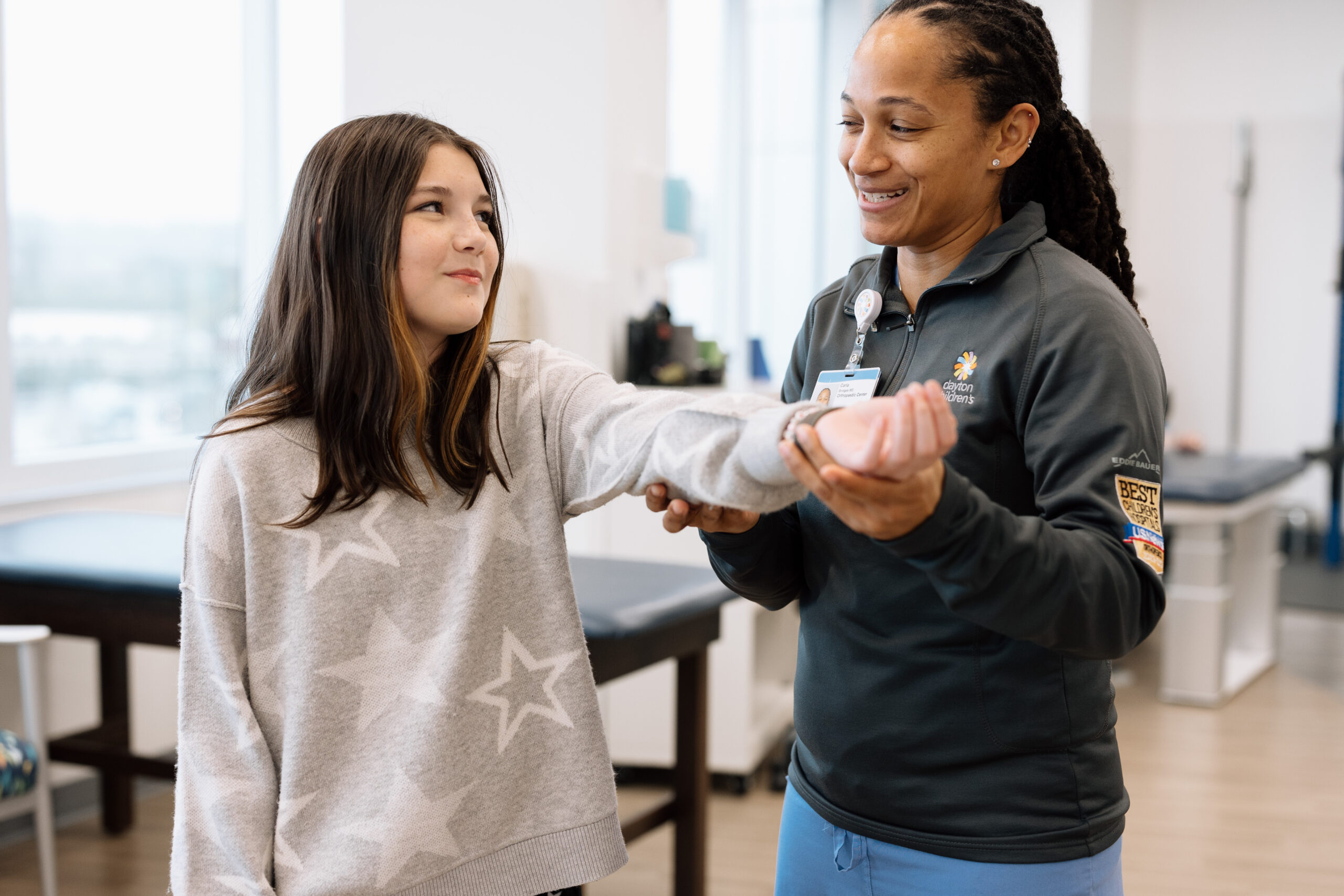 A pediatric orthopedic specialist works with a teen patient at Dayton Children's.
