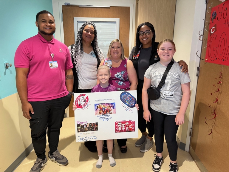 Eric with his family and care team at Dayton Children's