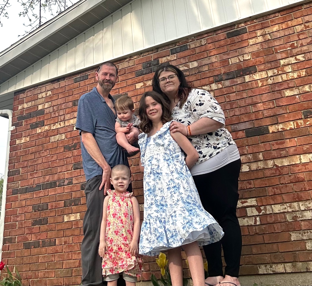 Ellie's family poses for a photo