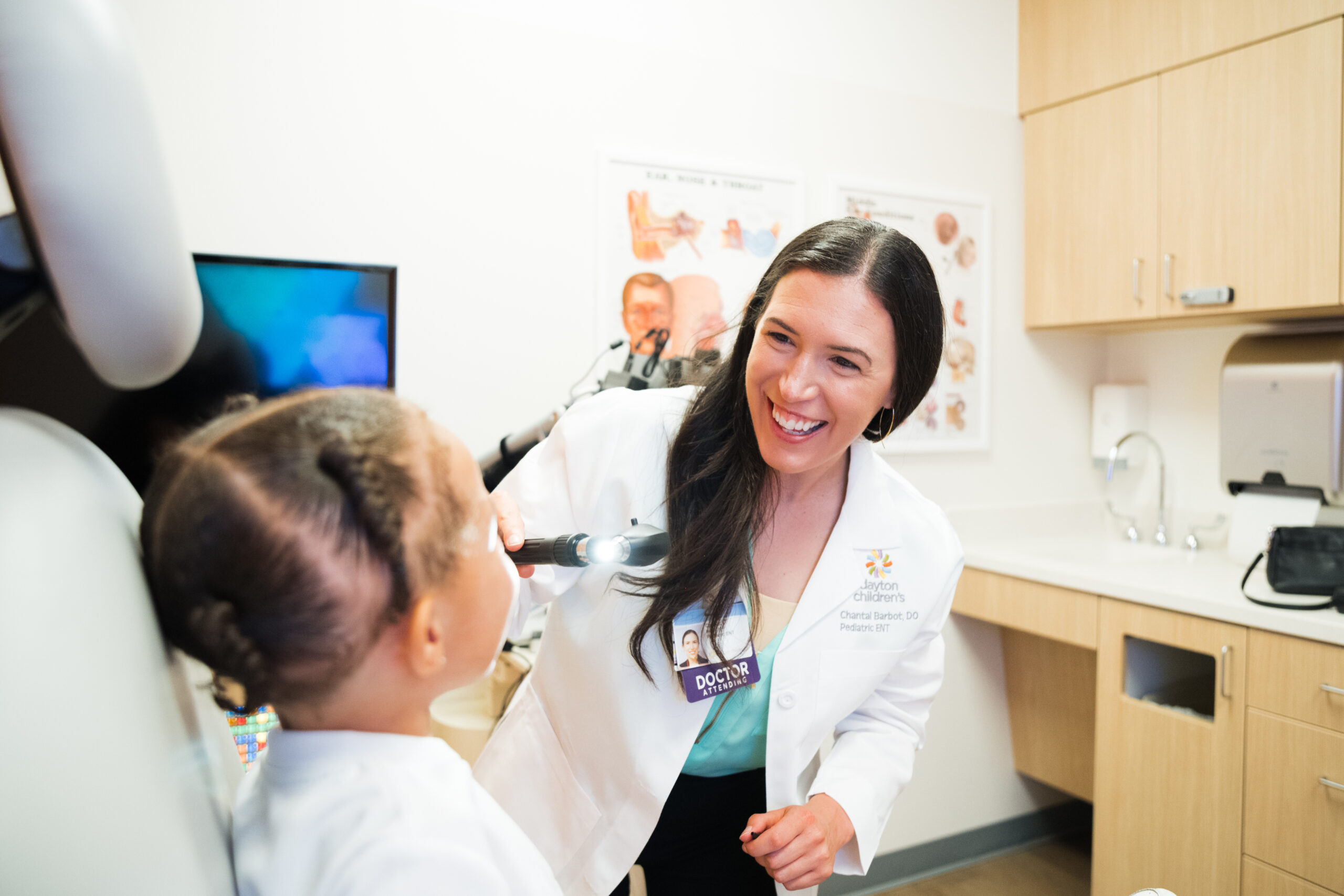 Dr. Barbot examines a young patient at Dayton Children's