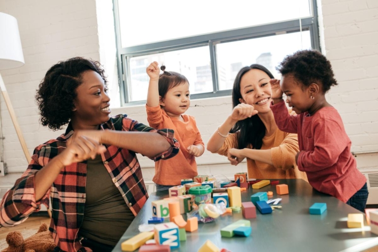 Toddlers and their mothers play together