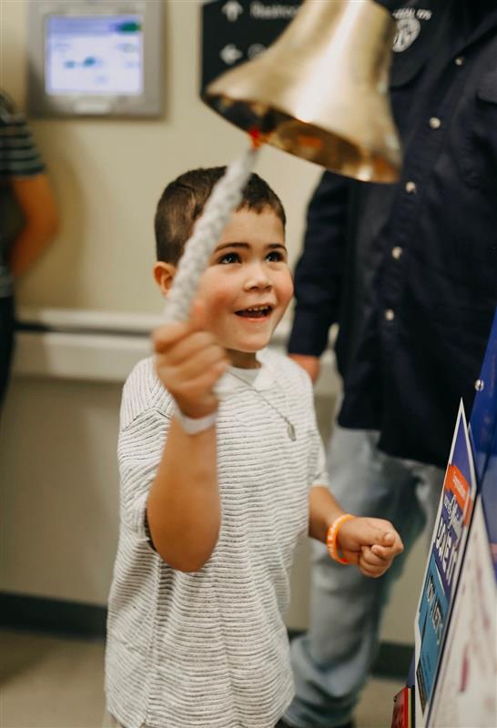 Tripp ringing the bell at Dayton Children's after becoming cancer free