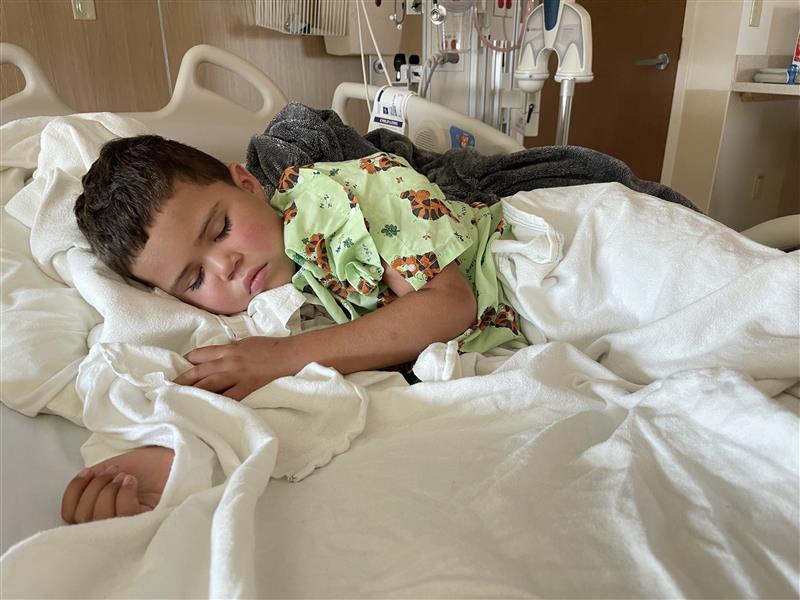 Tripp rests in a hospital bed at Dayton Children's