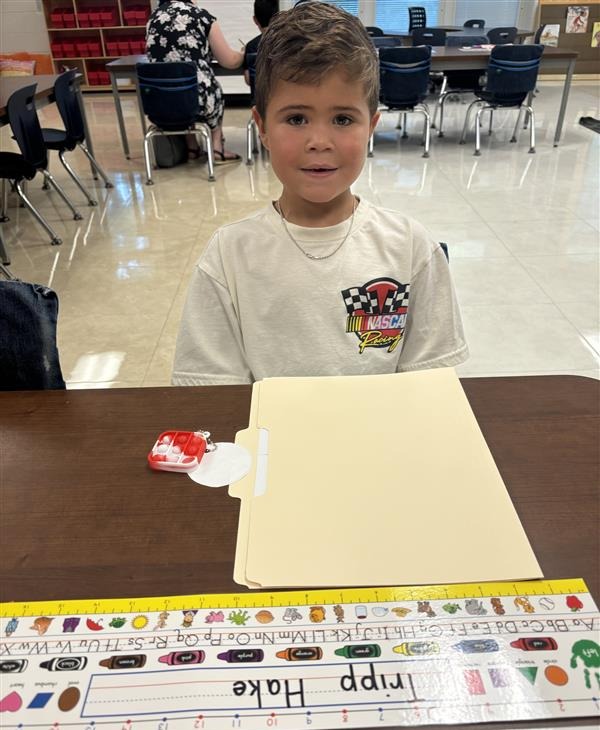 Tripp sitting in his 2nd grade classroom