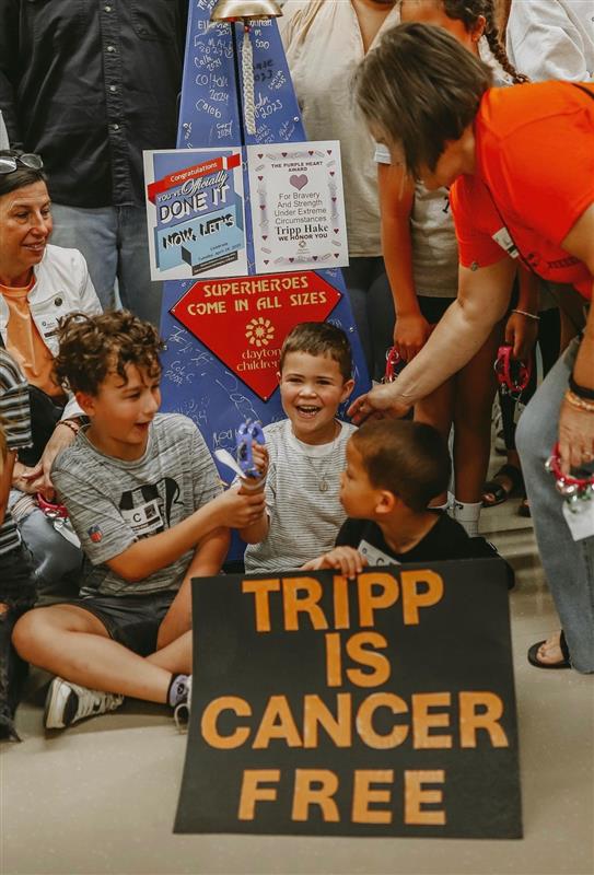 Tripp smiles while celebrating with family
