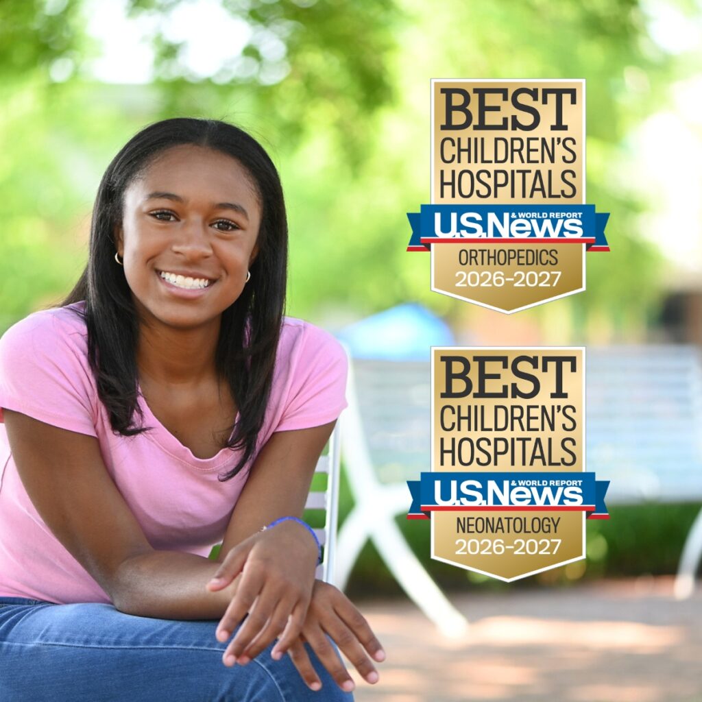 dayton children's teen girl patient smiles in pink shirt
